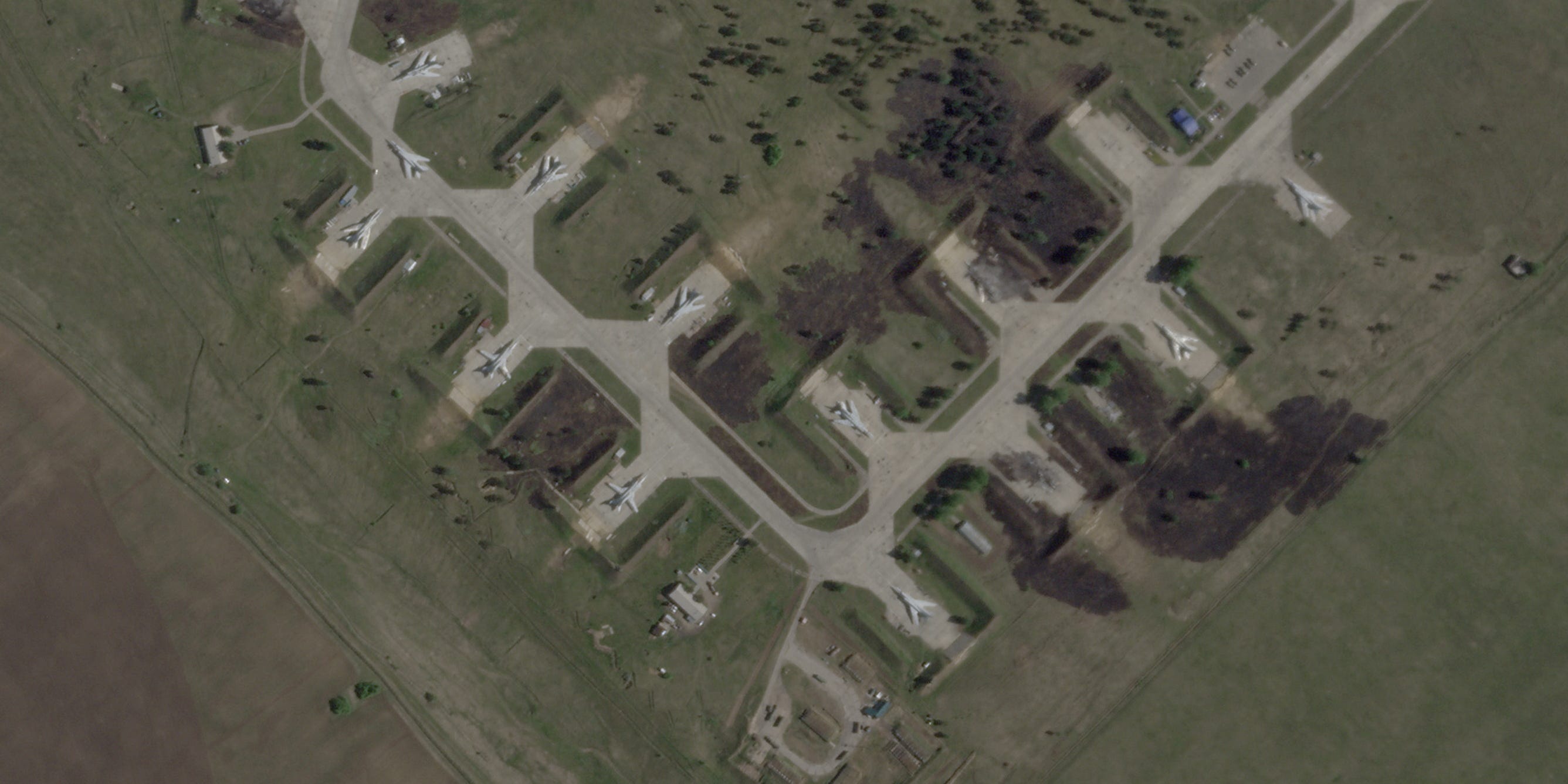 This image shows several damaged bombers at the Belaya airbase.