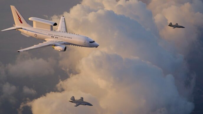 An artist’s rendering of a Royal Australian Air Force E-7A Wedgetail teaming with two MQ-28 Ghost Bat collaborative combat aircraft. (Boeing illustration)