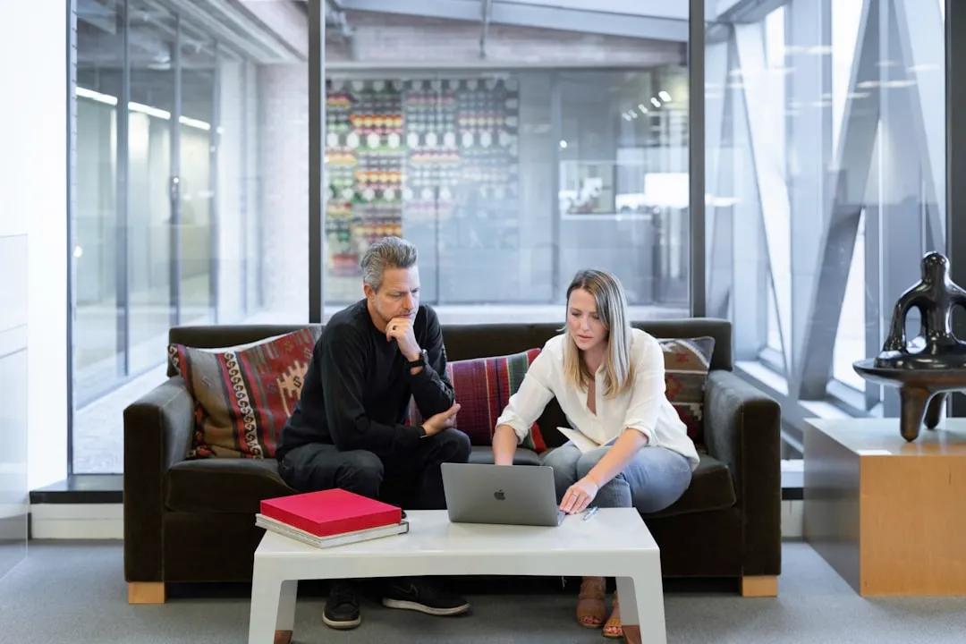 Employees discussing software knowledge management and its role in supporting business operations