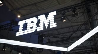 an IBM logo lit up on a dark background