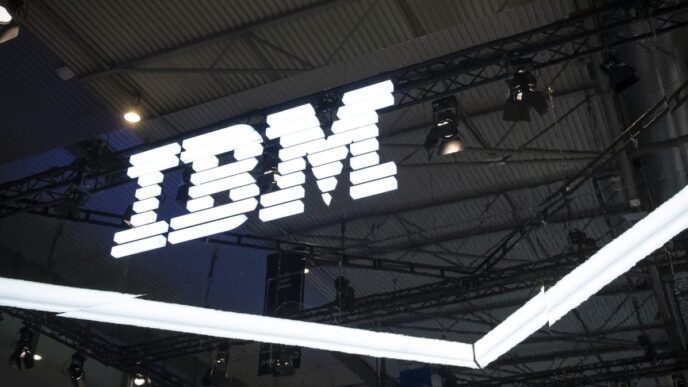 an IBM logo lit up on a dark background