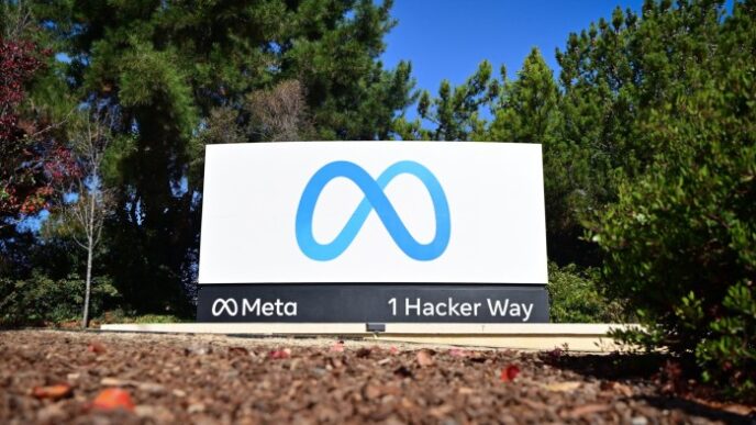 The Meta logo marks the entrance of their corporate headquarters in Menlo Park, California