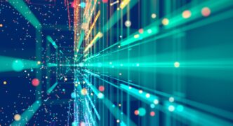 A stock image of bright teal blue and yellow lines of light angled toward you on a dark blue background