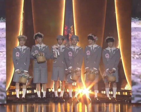 Stylists Criticized for Infantilizing Popular 5th Generation Boy Group 2 Matching shorts and flower garlands