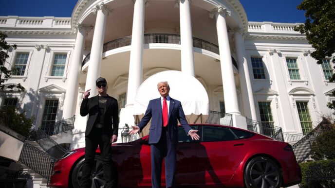 U.S. President Donald Trump and White House Senior Advisor, Tesla and SpaceX CEO Elon Musk deliver remarks next to a Tesla Model S on the South Lawn of the White House on March 11, 2025 in Washington, DC.
