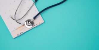 Stethoscope and a calendar. Doctor's appointment and service in the hospital.