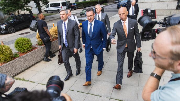 Trevor Milton, founder of Nikola Corp., center, exits court in New York, US