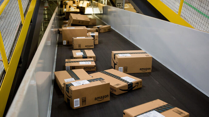 Boxes move along a conveyor belt at the Amazon.com Inc. fulfillment center on Cyber Monday in Robbinsville, New Jersey, U.S., on Monday, Nov. 30, 2015. Online sales on Cyber Monday may rise at least 18 percent from a year earlier, slower growth than during the holiday weekend, as consumers start their Internet shopping earlier, according to forecasts by International Business Machines Corp. Photographer: Michael Nagle/Bloomberg via Getty Images