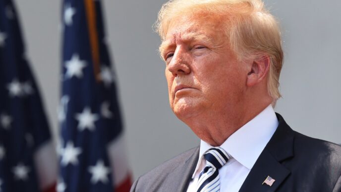 Trump in front of an American flag