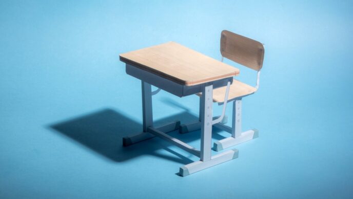Empty school desk on a blue background. .