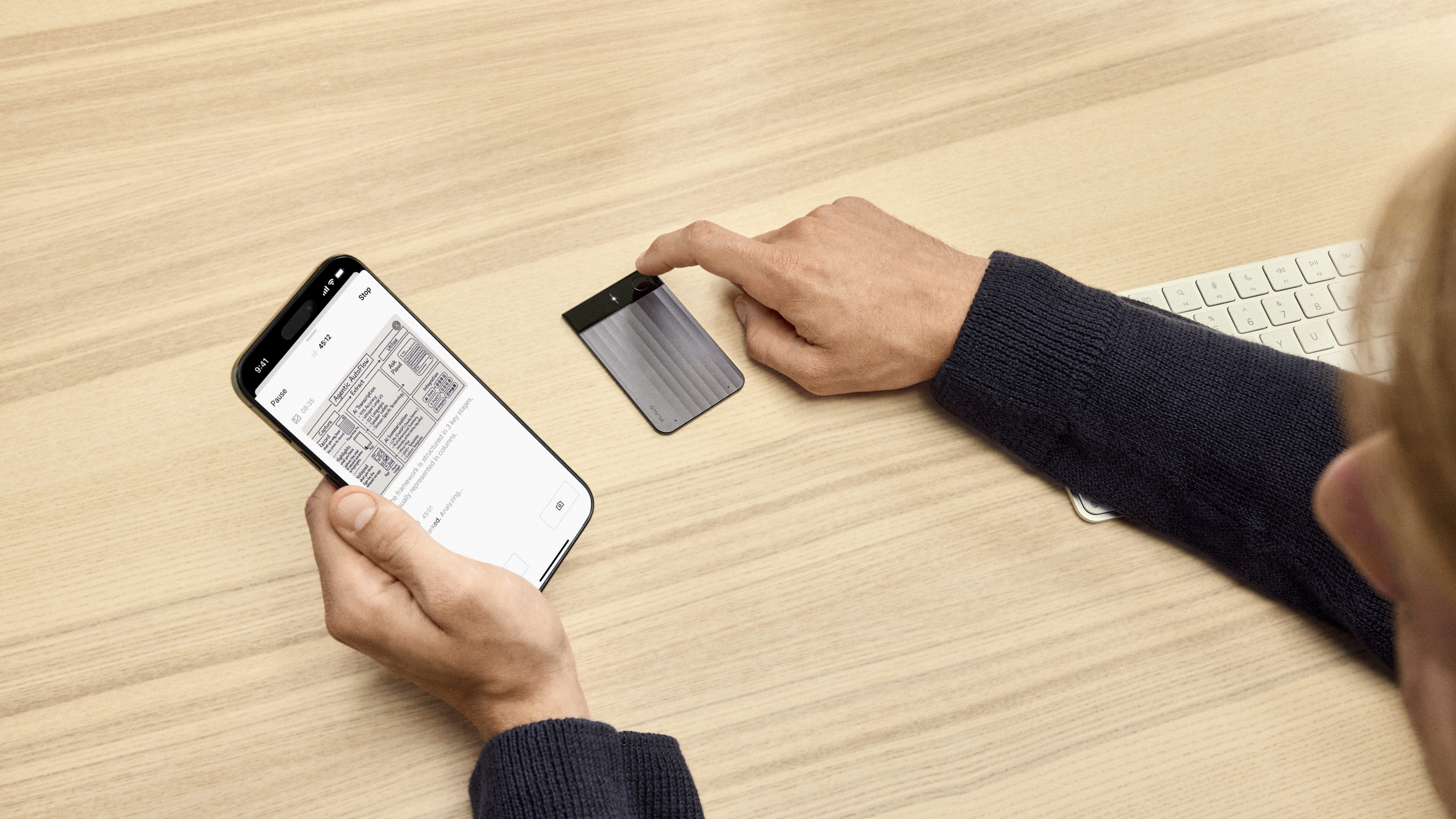 A person using Plaud AI notetaker while adding an image to notes using Plaud's app