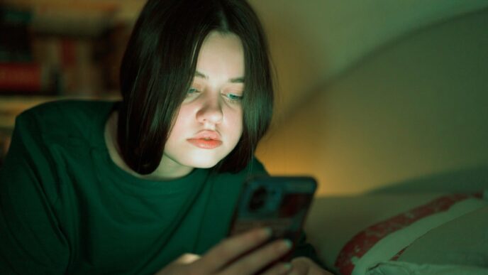 Portrait of a teenage girl looking at her mobile phone.